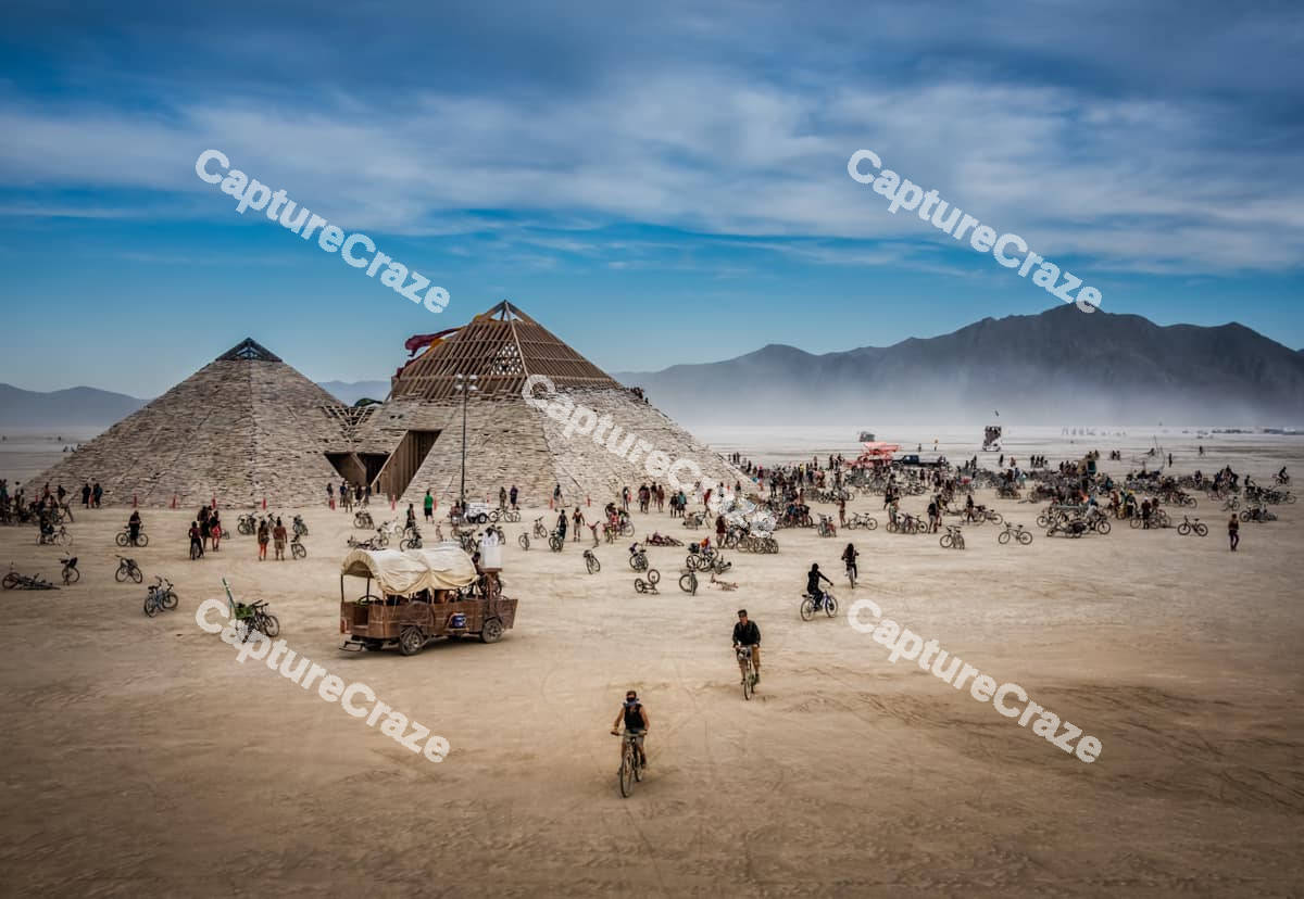 Pyramids with people on bicycles
